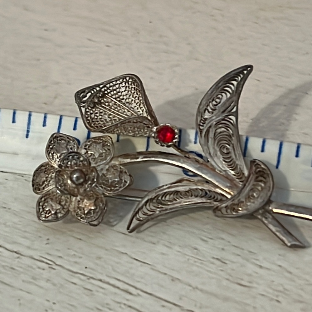Vintage filigree silver daisy Lily brooch with red accent unsigned